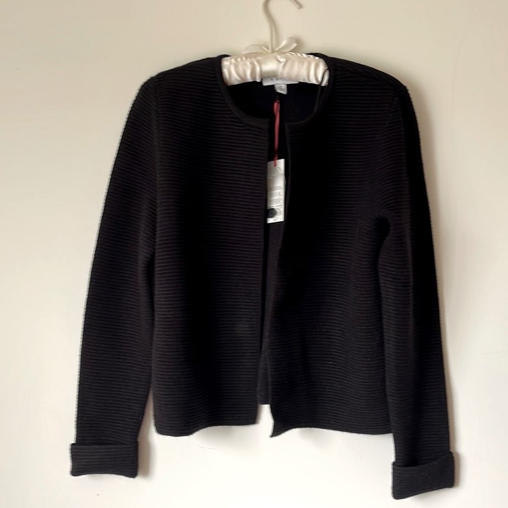 Heavy black short cardigan with cuffed sleeves.